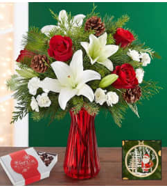 Holiday Bouquet With Chocolates. An arrangement by Brickell Ave Florist.