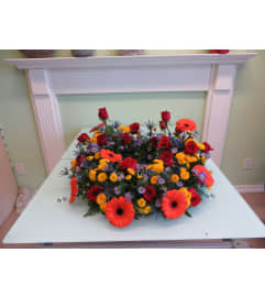 Treasured Sunset Urn. An arrangement by Floral Images.