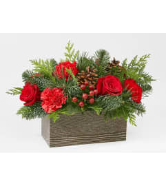 CABIN CHRISTMAS BOUQUET. An arrangement by Geni's Florist and Gifts.