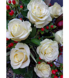 UPSCALE WHITE ROSES. An arrangement by Flowers by Priscilla.