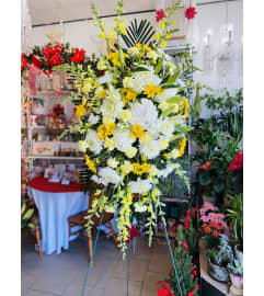 Sunlight Remembrance Spray. An arrangement by Sonia's Florist.