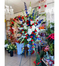 Patriotic Honor Standing Spray. An arrangement by Sonia's Florist.
