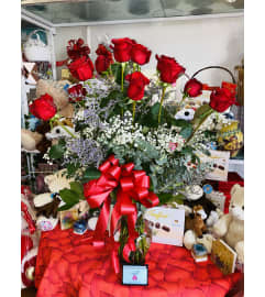 Red Dozen w/Fillers. An arrangement by Sonia's Florist.