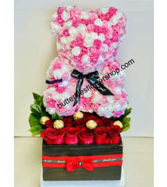 12 Roses and Pink and White Bear. An arrangement by Butterflies Flower Shop.
