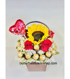 Sweet little Basket. An arrangement by Butterflies Flower Shop.