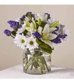 Beyond Blue Bqt Clear. An arrangement by Petals and Co..
