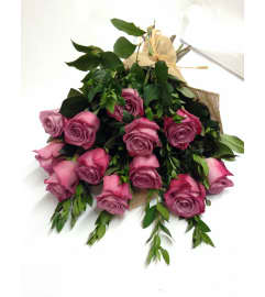 12 Purple Rose Wrapped. An arrangement by Jo-Dee's Blooms and Things.