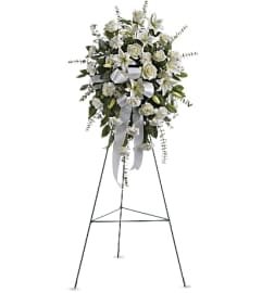 WHITE STANDING. An arrangement by Geni's Florist and Gifts.