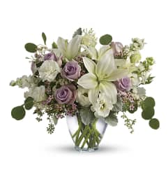 Lovely Lilies and Lavender Roses. An arrangement by Brooklin Floral and Garden Shoppe Inc..