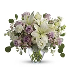 Lovely Lilies and Lavender Roses. An arrangement by Brooklin Floral and Garden Shoppe Inc..