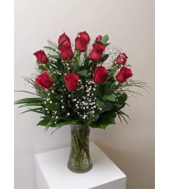 12 Red Roses arranged in a vase.. An arrangement by Flower Trends Florists.