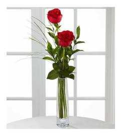 2 Red Roses Arranged in a Bud Vase. An arrangement by Sueppel's Flowers.