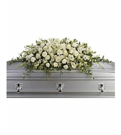 White Tranquility Casket Spray. An arrangement by Brickell Ave Florist. White Tranquility Casket Spray. An arrangement by Brickell Ave Florist.