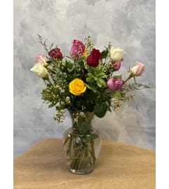 Dozen Assorted Roses. An arrangement by Masters and Company Florist.