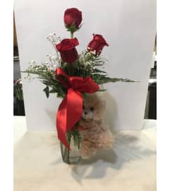 Rose bud vase with small bear. An arrangement by Renton Flower Shop.
