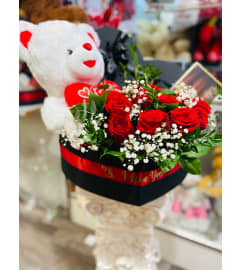 HEART TEDDY BUNDLE. An arrangement by Geni's Florist and Gifts.