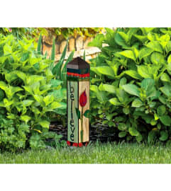 BELIEVE GARDEN ART POLE. An arrangement by Novak's Flower Shoppe.