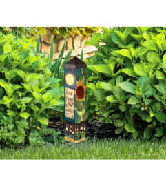 FIND PEACE GARDEN ART POLE. An arrangement by Novak's Flower Shoppe.