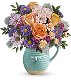 The Busy Bee Pitcher. An arrangement by Flowers of Jacksonville. The Busy Bee Pitcher. An arrangement by Flowers of Jacksonville.