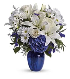 Beautiful in Blue Vase Bouquet. An arrangement by Love Story Florist.