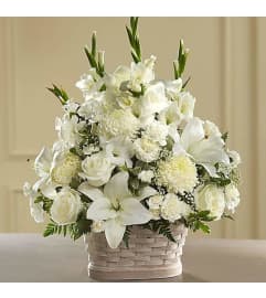 ELEGANCE BASKET. An arrangement by Geni's Florist and Gifts.