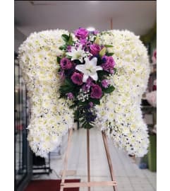 WINGS SKY REMEMBRANCE. An arrangement by Geni's Florist and Gifts.
