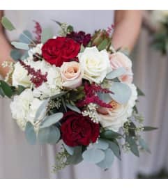 G BRIDE BOUQUET. An arrangement by Geni's Florist and Gifts.