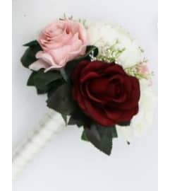 G BRIDESMADE BOUQUET. An arrangement by Geni's Florist and Gifts.