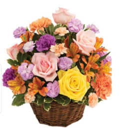 Springtime Sunset Basket. An arrangement by Prosper Blooms.