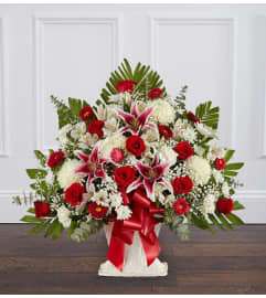 Red and White Sympathy Floor Basket. An arrangement by Elegant Florist.