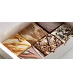 Assorted box of Momma G's Homemade Fudge per pound. An arrangement by Brown Floral and Fudge.