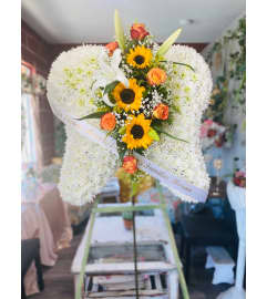 SUN SHINE WINGS. An arrangement by Geni's Florist and Gifts.