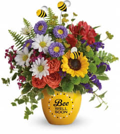 Bee Well Soon Garden (Teleflora). An arrangement by North Liberty Flower Shop.