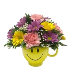 Colourful and Happy Mug. An arrangement by Nicol Florist.