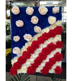 flags of the United States. An arrangement by Elegant Florist.