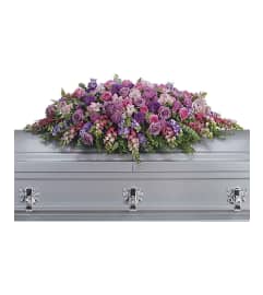 Lavender Tribute Casket Piece. An arrangement by Love Floral.