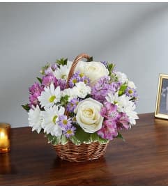 Lavender Lights Basket Arrangement. An arrangement by Flower Spot Florist.