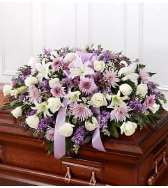 Lavender and White Mixed Half Casket Cover. An arrangement by Elegant Florist.