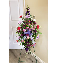Tenderly Sentimental Easel Spray. An arrangement by Flowers Plus.