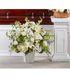 Funeral pure white. An arrangement by Eve's Baskets and More LLC.
