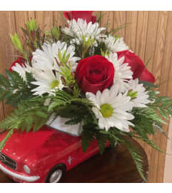 Red mustang. An arrangement by Floreria Mexico.