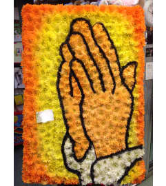 Prayer Hands. An arrangement by Elegant Florist.