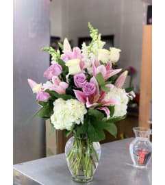 Lavender Delight Bouquet. An arrangement by Flower World and Gifts.