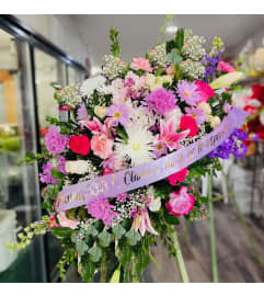 Spray Lilac. An arrangement by Geni's Florist and Gifts.