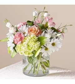 Flutter by a Bouquet. An arrangement by Geni's Florist and Gifts.