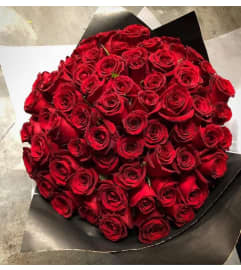 Wrap in paper. An arrangement by Butterflies Flower Shop.