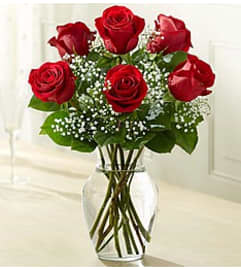 SIX RED ROSES BOUQUET. An arrangement by Geni's Florist and Gifts.
