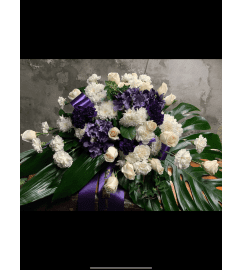 Cream Purple Casket Spray. An arrangement by Silver Rose Emotions.