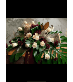 Casket Spray in Burgundy’s and Creams. An arrangement by Silver Rose Emotions.