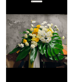 Yellow Bliss Casket Spray. An arrangement by Silver Rose Emotions.